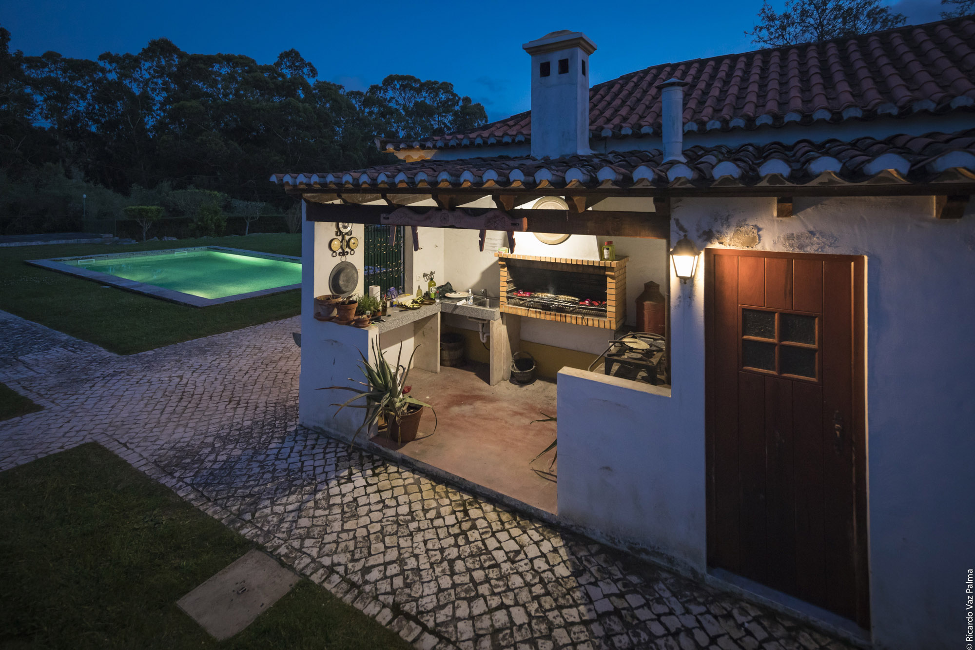 Barbecue and swimming pool at night