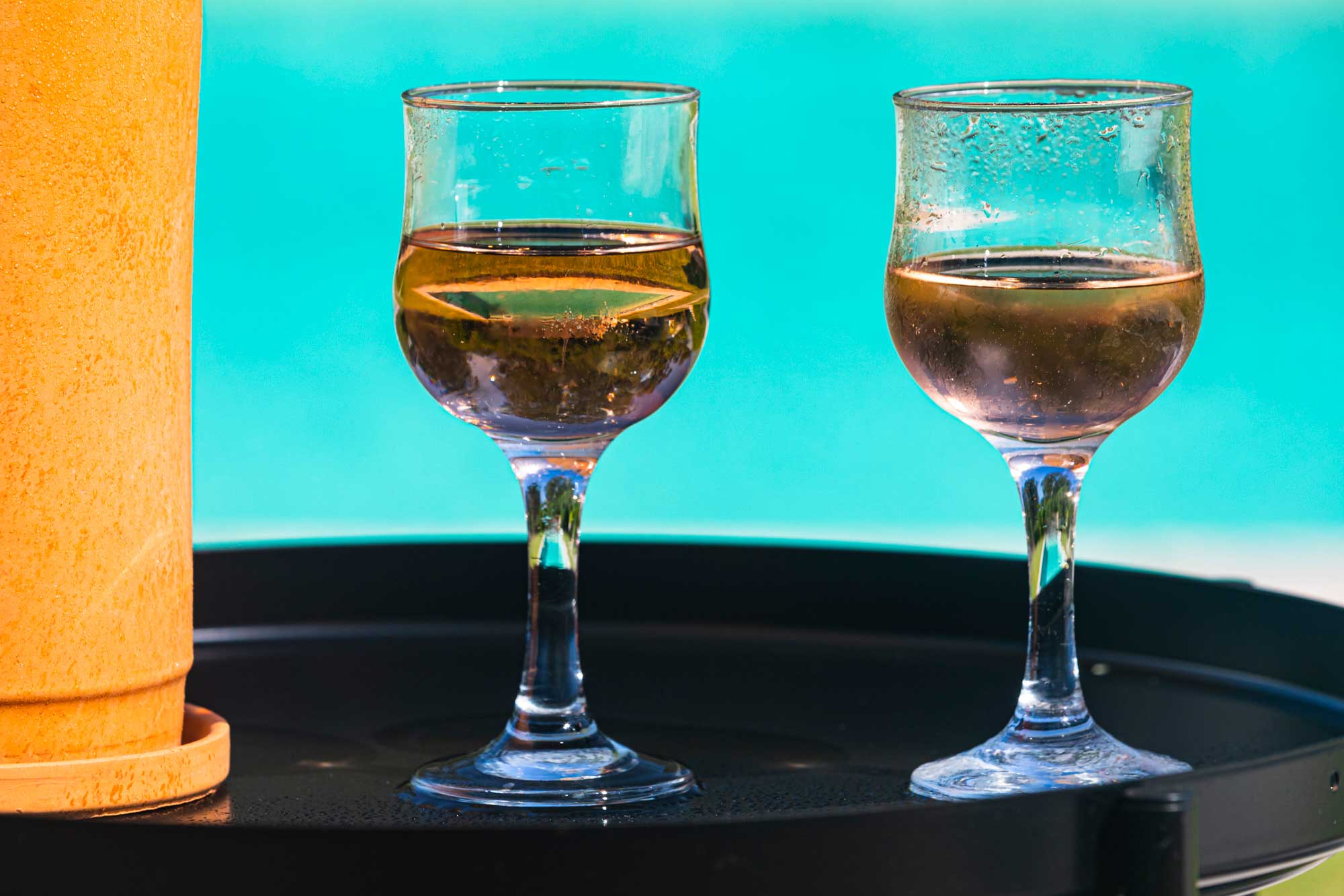Have a nice glass of wine by the swimming pool